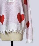 Woman's Heartbreaker Red Heart Print Distressed V-Neck Long Sleeve Sweater